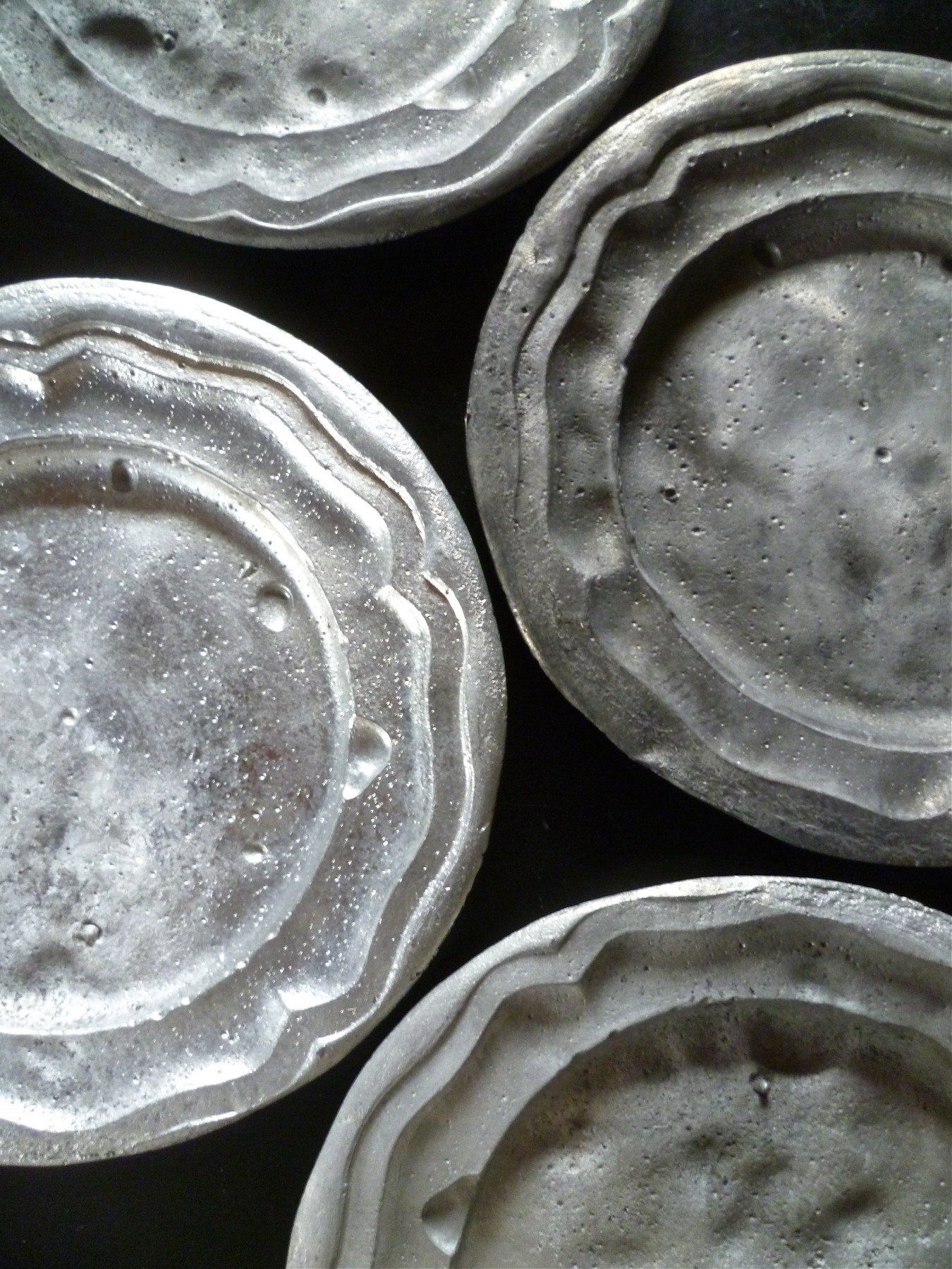 Image of a series of cast pewter plate