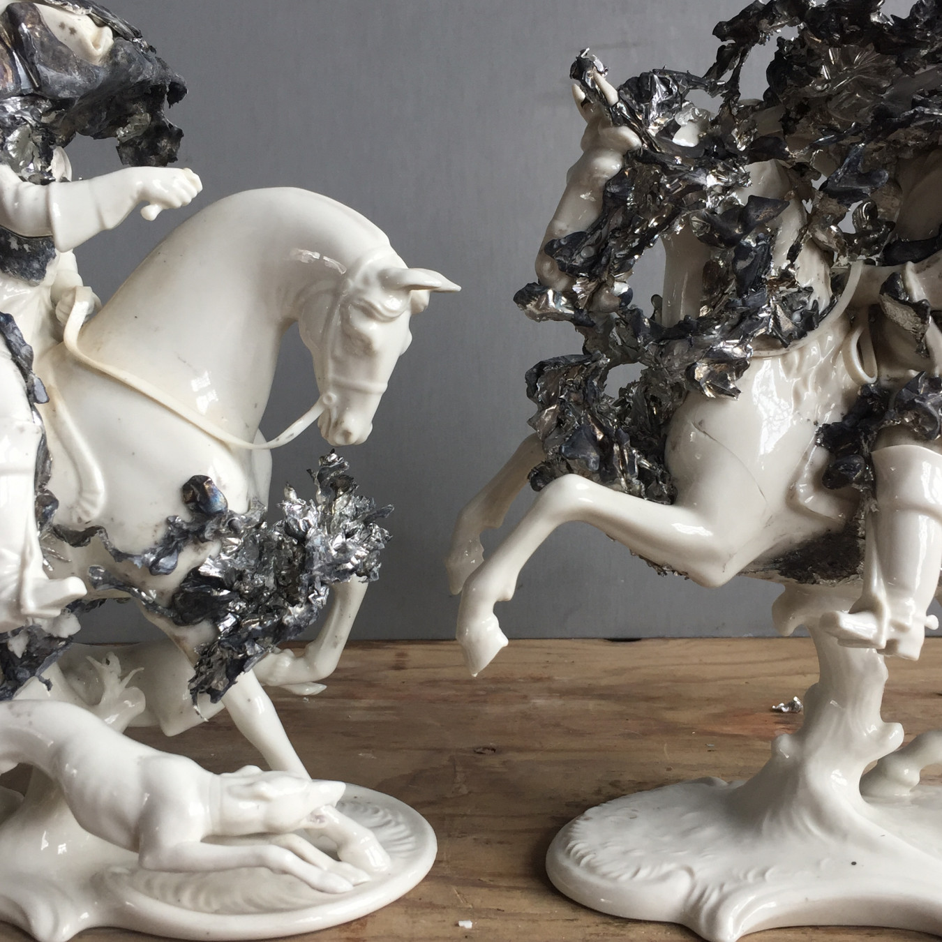 Image of a pair of horsemen on horses with hounds made by Nymphenburg Bavaria. Pewter has been poured in and the explosion recorded physically