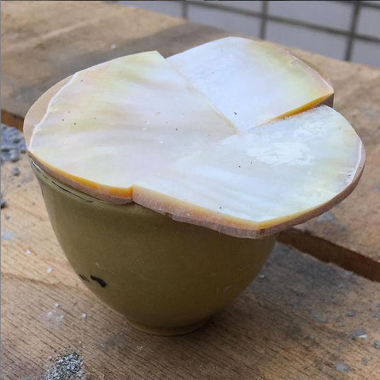 Image of a small ceramic cup with a new mother of pearl lid made of 3 pieces